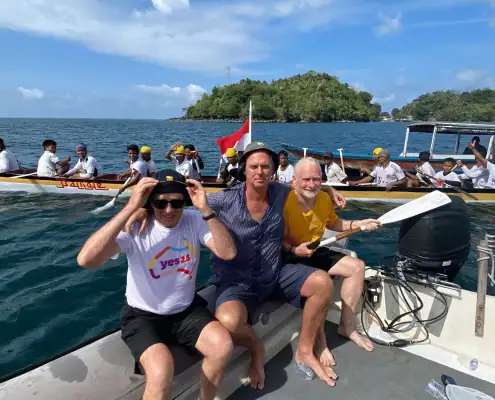 Barry Clarke and fellow SeaTrek guest taking photo with Kora-Kora from the tender