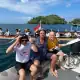 Barry Clarke and fellow SeaTrek guest taking photo with Kora-Kora from the tender