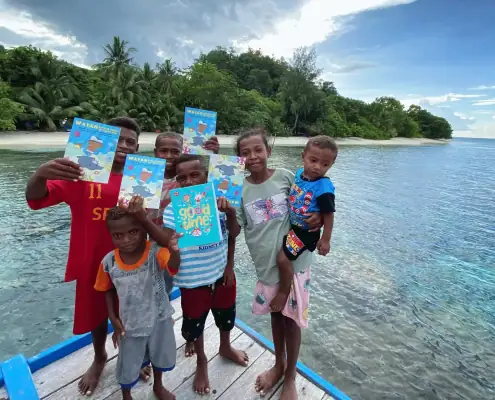 Kids with the Wayan and the Turtle King book