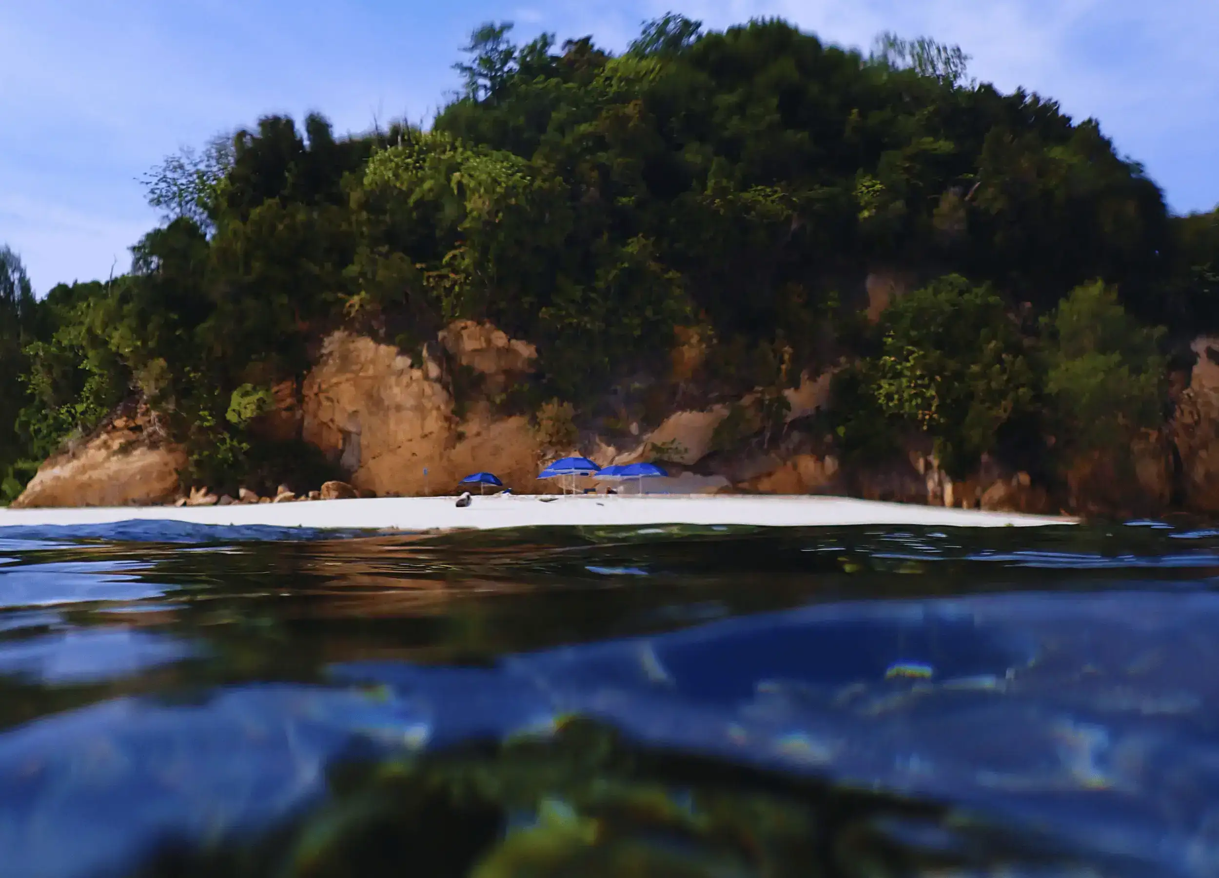 SeaTrek's guest enjoy snorkeling and beach time in Hiriuli, Raja Ampat