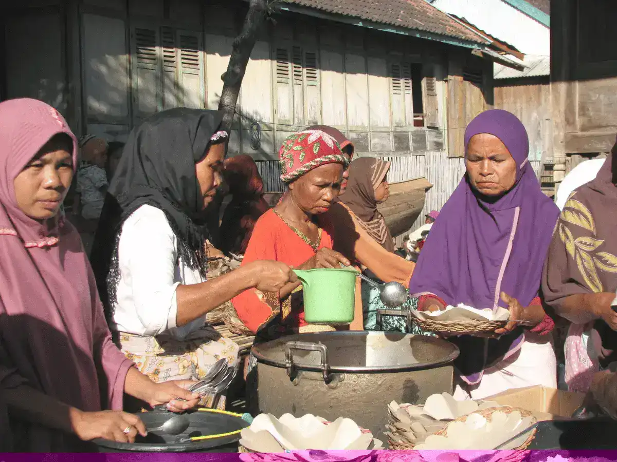 Wera locals feeding workers launching boat