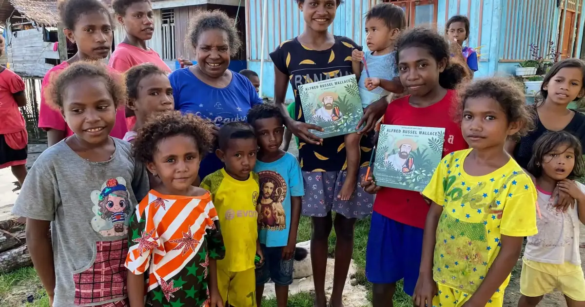 Distributing Wallace Book to Villages.