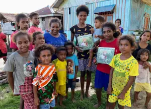 Distributing Wallace Book to Villages.