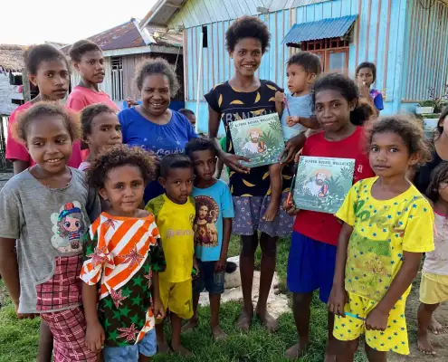 Distributing Wallace Book to Villages.