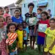 Distributing Wallace Book to Villages.