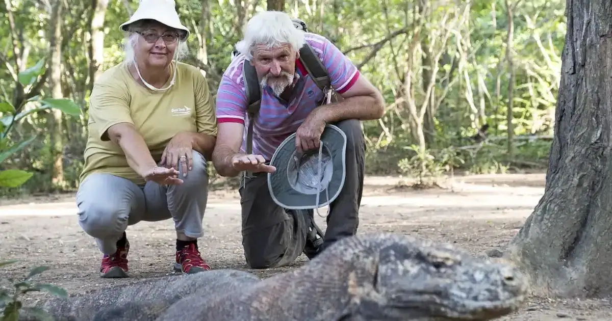 SeaTrek's guest taking photo with the Komodo Dragon
