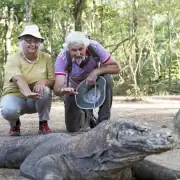 SeaTrek's guest taking photo with the Komodo Dragon
