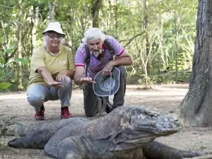 SeaTrek's guest taking photo with the Komodo Dragon