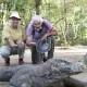 SeaTrek's guest taking photo with the Komodo Dragon