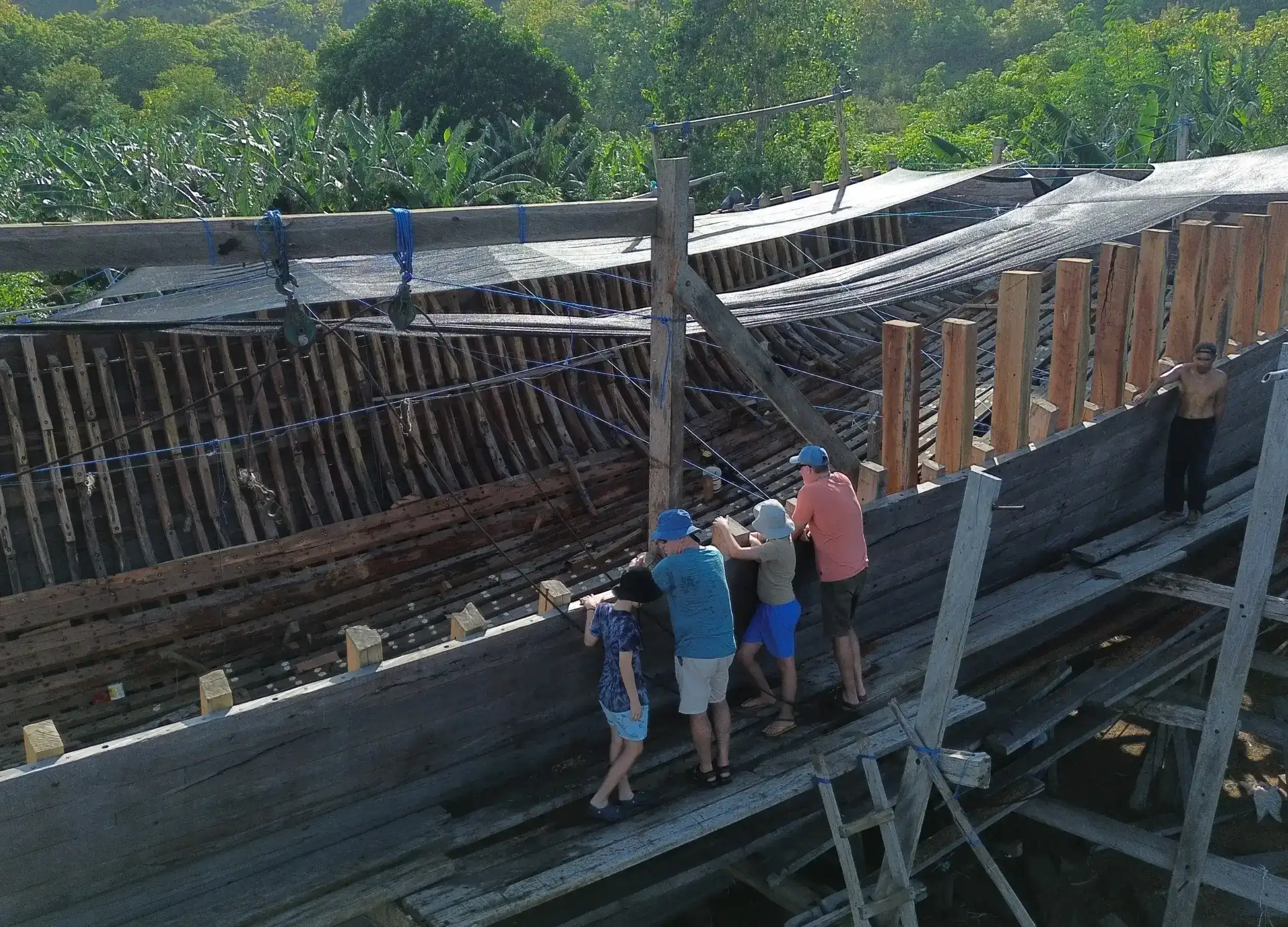 The Hill Family visiting the traditional boatbuilder in Sangeang