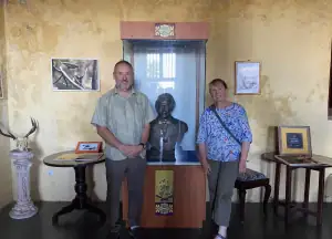 Bill Wallace and Natalie with Alfred Russel Wallace statue in the museum in Ternate