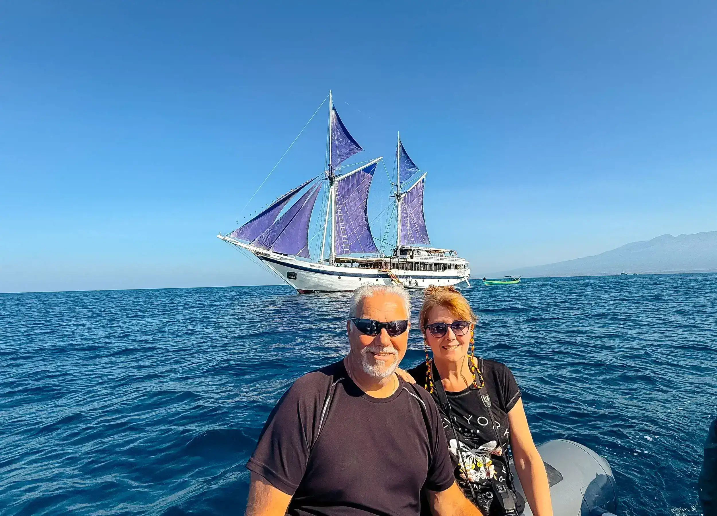 SeaTrek expert ray and angela hale with ombak putih sails up in the background.