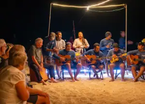 crew and guests singing at the BBQ night