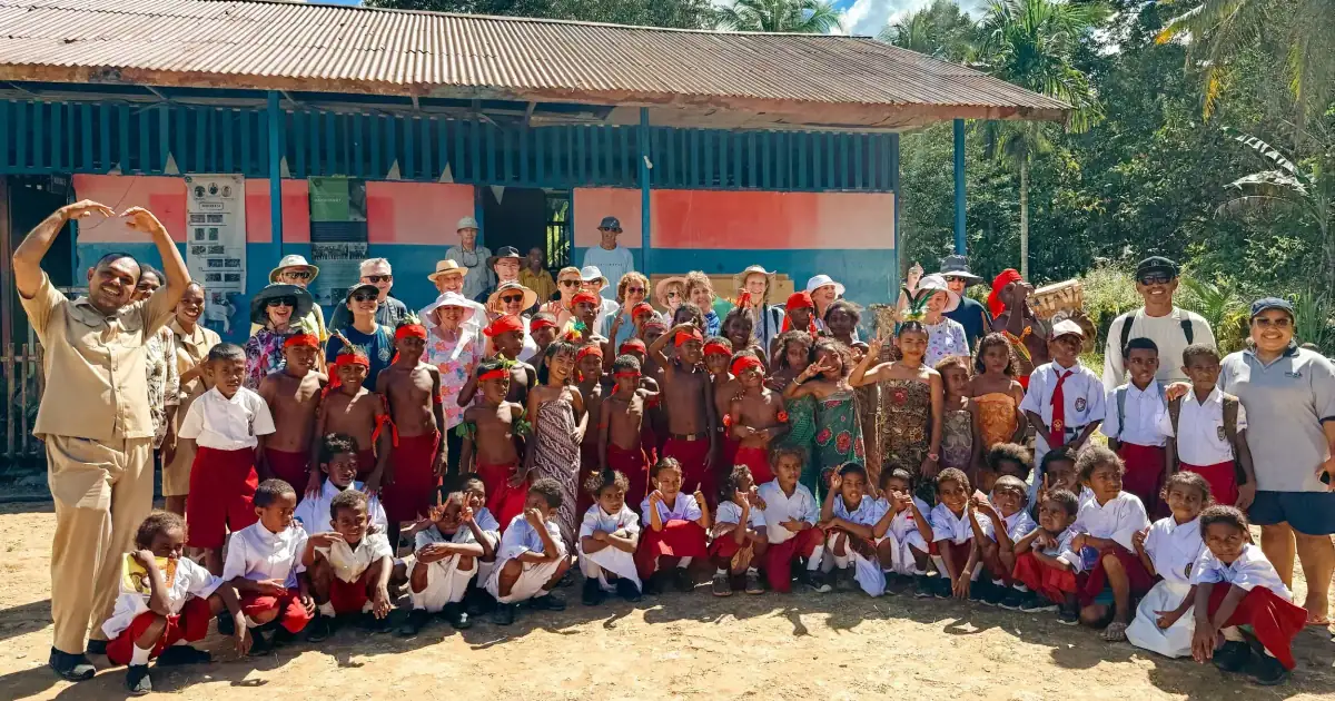 Group photo with teachers and students of Aduwei school after the library handover.