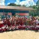 Group photo with teachers and students of Aduwei school after the library handover.