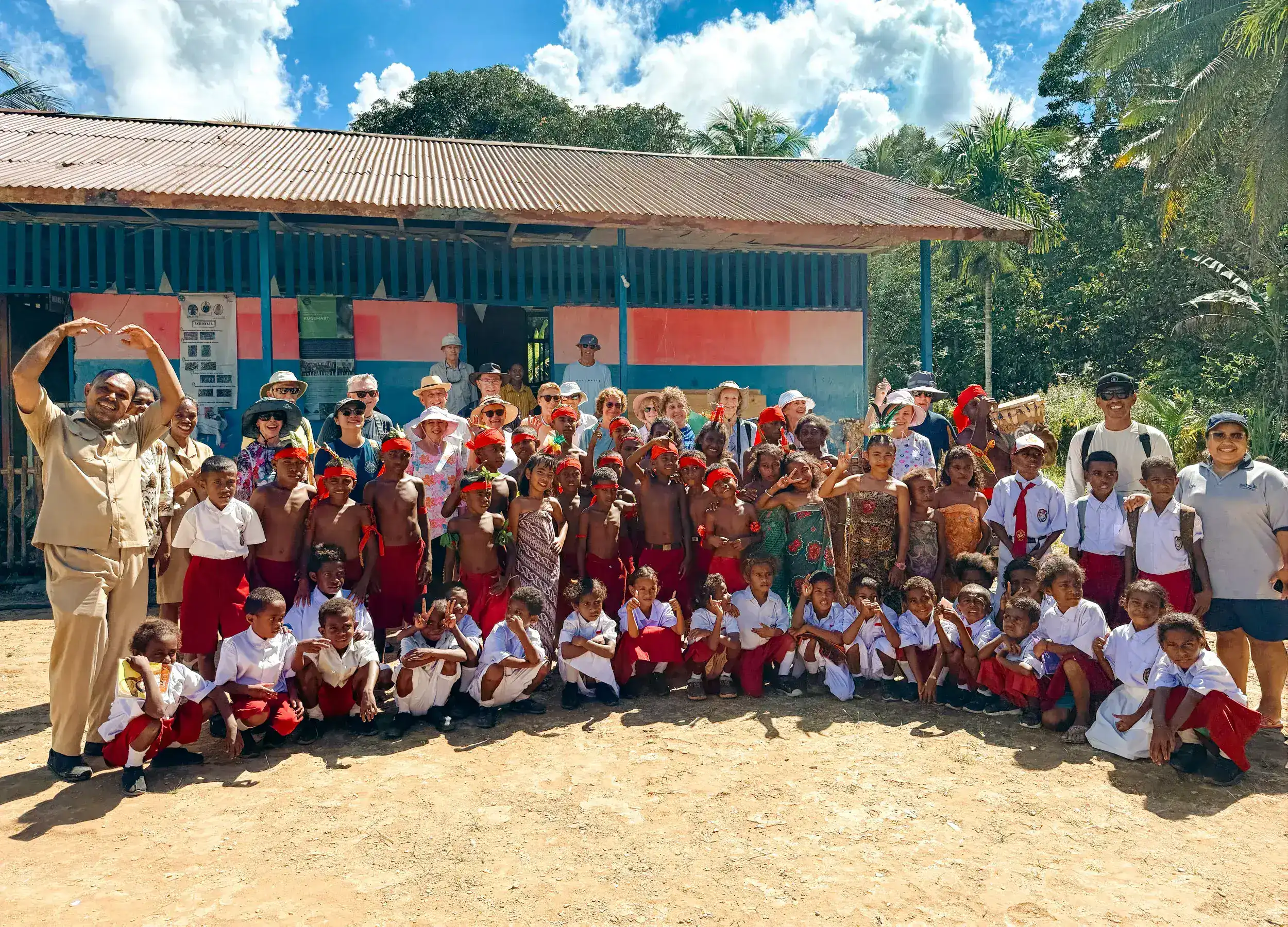 Group photo with teachers and students of Aduwei school after the library handover.