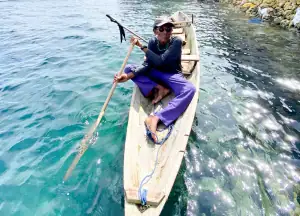 Jago rowing his kayak