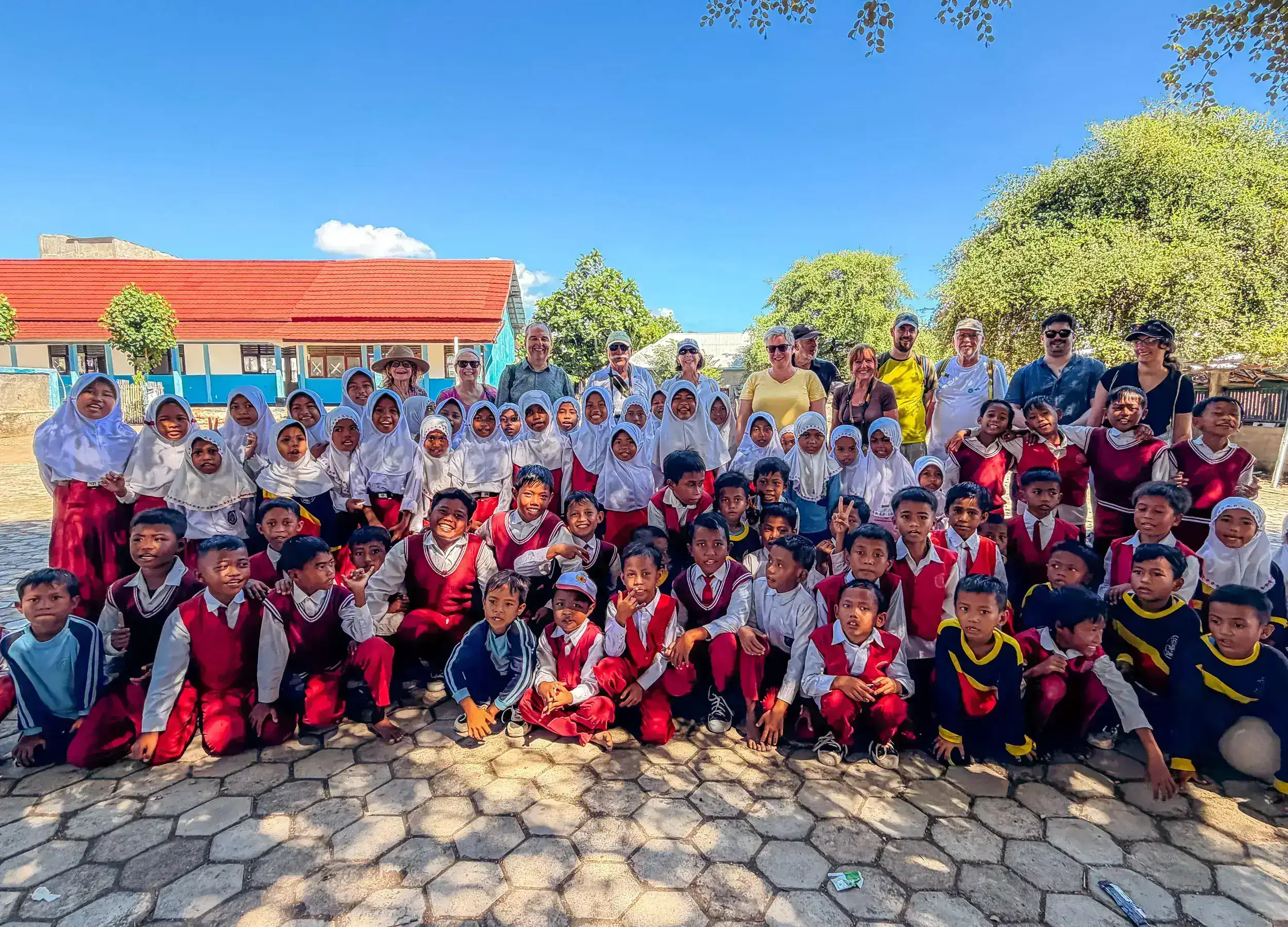 Group photo with students in the village