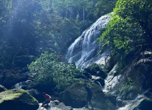 Playing near the waterfall in Ternate